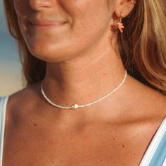 MELATI SHELL BEADED NECKLACE Get your surf on with the Melati Shell Beaded Necklace! This beachy necklace features a beautiful white shell and is inspired by the national flower of Bali, known for its symbolism of purity. This unique piece of jewelry is perfect for surfers who want to bring a little bit of the ocean with them wherever they go! - Made with round shimmering troca shell beads, centred with a dainty seashell strung on our durable wax polyester cord. - Measures approx. 36cm with a 24 Summer Jewelry Diy, Shell Beaded Necklace, Beachy Necklace, Surf Necklace, Shell Beads Necklace, Necklace Shell, Beachy Jewelry, Holiday Necklace, National Flower