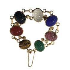 Vintage 14 Karat Yellow Gold Scarab Bracelet- This Lovely Scarab Bracelet Features Onyx, Jade, Quartz, Lapis Lazuli, Coral An Tiger's Eye Gemstones Set In Classic 14k Yellow Gold. Each Stone Measures 16 Mm X 12 Mm. Size: 6.5 Inches Weight: 12.4 Dwt. / 19.3 Gr. Tested 14k Gold. Very Good Condition, Professionally Polished. Will Come Packaged In A Gift Box Or Pouch (When Possible) And Will Be Shipped U.S. Priority Mail Insured. Dv102422/17kcs Scarab Bracelet, Tigers Eye Gemstone, Tiger's Eye, Jewelry Vintage, Estate Jewelry, Womens Jewelry Bracelets, Lapis Lazuli, Blue Gold, Priority Mail