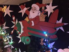 a christmas display with santa claus on an airplane