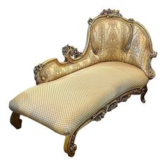 an antique style chaise lounge with ornate carvings