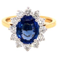 An impressive 3.46 carat total gem weight, 2.46 carat Blue Sapphire Dress / Engagement Ring surrounded by a claw set diamond halo With a total diamond weight of 0.99 carat white colour G, clarity VS / SI round brilliant cut diamonds. This Ring has been beautifully set in 18 Karat Gold with white claws to show the best sparkle of the sapphire and diamonds, British Hallmark. This design can be bespoke on request, size and gemstones. Please note these rings are uniquely hand made and the weight of White Claws, Sapphire Dress, Dress Engagement, Sapphire Diamond Ring, Birthstone Gifts, White Colour, Green Tourmaline, Diamond Halo, Halo Engagement Ring