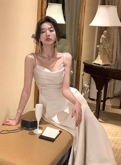 Elegant White Suspender Dress For Night Out, Elegant Sleeveless Slip Dress For Banquet, Elegant Spaghetti Strap Dress For Banquet, White Strapless Slip Dress For Party, Elegant Sleeveless Suspender Wedding Dress, Elegant Party Suspender Dress With Spaghetti Straps, Elegant Suspender Dress With Spaghetti Straps For Party, Elegant White Suspender Dress For Evening, Elegant White Evening Suspender Dress