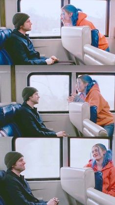 two people sitting on a train looking at each other