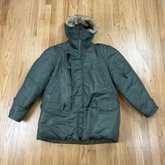 Vintage USAF N 3B Flight Crew Heavy Jacket Parka w/ Fur Hood Trim Olive Green Nice preowned condition with limited wear and some light staining. Fur trim is in good overall condition but does appear to have some light shedding. Approx. Dimensions (lying flat) Chest (pit to pit): 26 in Top to Bottom: 32 in Sleeves (armpit to arm cuff): 19 in Vintage Khaki Outerwear For Cold Weather, Winter Utility Outerwear With Storm Flap, Vintage Green Hooded Outerwear, Green Hooded Vintage Outerwear, Military Style Windproof Hooded Parka, Military Style Hooded Windproof Parka, Winter Military Hooded Outerwear, Military Style Outerwear With Double-lined Hood For Cold Weather, Military Style Khaki Hooded Jacket For Cold Weather