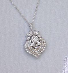 "We have designed our Camille crystal bridal necklace in an elegant and modern-vintage style which is studded with marquise, baguette and round cut crystals A timeless accessory. WE have earrings to match as in our last two photos and they can be found at: https://www.etsy.com/listing/286408497 https://www.etsy.com/listing/225414085 This listing is for the necklace ONLY. 💜 Available in rose gold, silver (rhodium) and gold Measures: L = 16.5\" (42 cm) + 2\" extender chain (optional) Pendant= 1.7 Gold Crystal Necklace, Bridal Statement Earrings, Necklace White Gold, Silver Chandelier Earrings, Vintage Style Necklace, Crystal Jewelry Sets, Taylor S, Necklace Wedding, Necklace Crystal