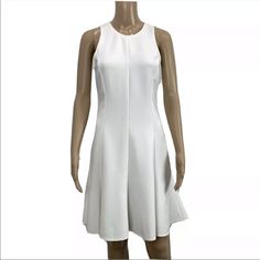 Elizabeth And James Women's Bristol White Sleeveless Flute Mini Dress Elegant Size 4 Retail: $395 Approximate Measurements 37" Length 16" Flat Chest **New With Tags, Has Dust Marks, No Defects, See Pics** Dry Clean Ship Daily White Stretch A-line Sleeveless Dress, White Sleeveless Dress With Flattering Silhouette, Stretch A-line Sleeveless Dress, White Sleeveless A-line Dress With Fit And Flare, White A-line Sleeveless Fit And Flare Dress, White Sleeveless A-line Dress Fit And Flare, Spring Dresses With Flattering Silhouette And Flared Hem, Fitted Sleeveless Dress With Flattering Silhouette For Spring, Fitted Flattering Sleeveless Dress For Spring