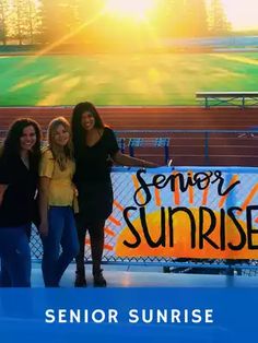 three women standing in front of a sign that says senior sunrise on the sidelines