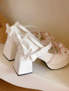 Step into a world of elegance and charm with our Bow at Top White and Pink Sweet High Block Heel Mary Janes. These shoes are the perfect blend of classic design and modern style. A delicate bow adorns the top, adding a touch of sweetness and femininity. The sturdy high block heel provides both height and stability, making these shoes perfect for all-day wear. The Buckle Ankle Strap provides secure wear.  The price is for a pair of shoes only, others are not included.  Garment Size   	 		 			Size Vintage White Heels With Ankle Strap, Vintage White Ankle Strap Heels, Cute White Block Heels, Cute White Heels For Party, Cute White Platform Heels, Cute White Party Heels, White Feminine Heels With Round Toe, Feminine White Heels With Round Toe, Vintage White Platform Heels