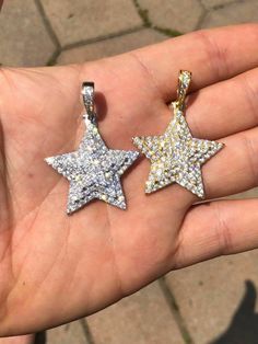 "Custom made super iced out STAR PENDANT. Made from 100% Solid 925 Sterling silver and finished in your choice of either Rhodium or 14k yellow gold. Adorned with 200 micro paved simulated diamonds (CZ) to give this piece an amazing super icy look! Measures approximately 1.25\" x 1.25\" and weighs approximately 8 grams. You can buy pendant only or with choice of 18-30\" 2.5mm diamond cut ball moon chains IF YOU WANT PENDANT ONLY, SELECT \"0\" Chains are also solid sterling silver and come with a Sparkling Silver Starburst Jewelry, Dazzling Star-shaped Sparkling Jewelry, Dazzling Sparkling Star Jewelry, Sparkling Star-shaped White Gold Jewelry, White Gold Pendant Necklace With Star Charm, Dazzling Silver Star Jewelry, Dazzling Silver Starburst Jewelry, Sparkling Sterling Silver Star Jewelry, Dazzling Star-shaped Jewelry Gift