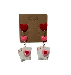 pair of earrings with playing cards and hearts