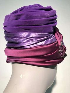 For Sale on 1stdibs - A gorgeous 1950s turban-styled hat in purple velvet, purple satin and burgundy satin with a rhinestone and pearl brooch at front. No maker label present. Purple Fitted Turban For Parties, Fitted Purple Turban For Parties, Elegant Pink Turban For Party, Fitted Purple Party Turban, Elegant Evening Fitted Turban, Elegant Evening Turban, Evening Hat, Velvet Purple, Large Brim Hat