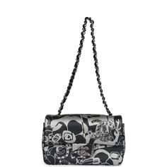 This mini Rectangular flap bag is of black and silver printed lambskin leather with ruthenium tone hardware and has a front flap with signature CC turnlock closure, rear half moon pocket, single interwoven black leather and ruthenium tone chain link shoulder/crossbody strap.The interior is lined in black leather and features a zipper pocket with Chanel pull and an open pocket below.Collection: 22C (RFID Chip)Origin: FranceCondition: New and never worn (plastic on hardware)Accompanied by: Chanel box, Chanel dustbag, felt, RFID, retail UPCMeasurements: 8" width x 5" height x 2.5" depth; 22.5" strap drop Everyday Black Flap Bag With Silver-tone Hardware, Designer Luxury Flap Bag With Silver-tone Hardware, Luxury Rectangular Flap Bag With Silver-tone Hardware, Luxury Double Flap Bag With Silver-tone Hardware, Black Rectangular Flap Bag With Silver-tone Hardware, Chanel Mini Rectangular, Chanel Box, Chanel Mini, Celine Bags