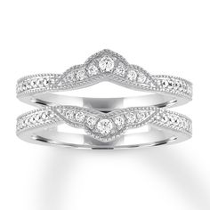 two white gold wedding bands with diamonds on each band, set in 18k white gold