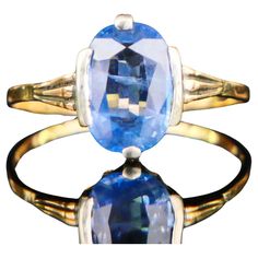 A Ring from the period of my Grandmother's childhood in solid 18K Yellow Gold with a crown in Silver holding natural Cornflower / Light Blue Sapphire of oval diamond cut 10 mm x 7 mm x 3.33 mm / ca. 2.5 ct. Stone demonstrates two spectacular Nebulosa with thousands of peculiar micro-inclusions, silk, and color zoning. Light Blue Color, transparent stone - image 9 shows the texture of the finger's skin seen through the stone. Likely of Ceylon origin. Swedish hallmarks, 18K, Malmö, maker's GD&Co, Vintage Sapphire Ring With Diamond Cut, Oval Shape, Antique Brilliant Cut Yellow Gold Sapphire Ring, Vintage Oval Sapphire Ring With Diamond Cut, Antique Yellow Gold Sapphire Ring With Brilliant Cut, Vintage Sapphire Ring With Diamond Cut For Collectibles, Vintage Oval Sapphire Ring Hallmarked, Vintage Sapphire Ring With Diamond Cut For Collectors, Vintage Oval Sapphire Ring With Hallmark, Victorian Oval Sapphire Ring With Prong Setting