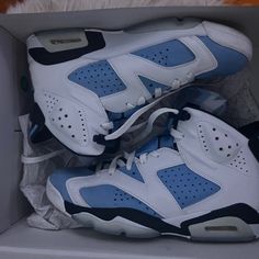 Jordan 6 Unc Blue Low-top Sneakers With Contrasting Heel, Blue Low-top Sneakers With Contrasting Heel Counter, Blue Sneakers With Translucent Outsole And Round Toe, Blue High-top Sneakers With Contrasting Heel, Sporty Jordan Shoes With Branded Heel Counter, Blue Sneakers With Contrasting Heel And Round Toe, Casual Blue Jordan Shoes With Contrast Sole, Blue Leather Sneakers With Translucent Outsole, Jordan 4 Women