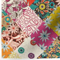 a colorful patchwork quilt with many different designs