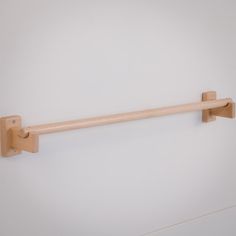 a wooden handle on a white wall