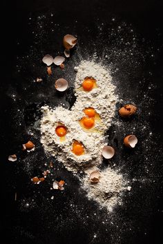 flour and eggs on a black surface by jovan rijec for stocks & jones