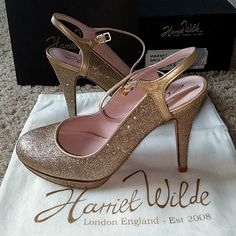 Harriet Wilde - Margo Gold Glitter Heels Brand New In Box - Still Has Protective Liner In The Soles. Come With: Box, Heels, Cloth Carrying Bag, Booklet And More. ~Style Up Your Life With Your New Fancy Heels!~ Glitter Closed Toe Wedding Shoes For Events, Champagne Glitter Heels For Gala, Gold Sparkling Heels For Gala, Glitter Heels With Ankle Strap For Events, Glitter Ankle Strap Heels For Events, Chic Glitter Heels For Events, Gold Glitter Heels For Events, High Heel Wedding Heels With Shimmer, Gold Glitter Closed Toe Wedding Shoes