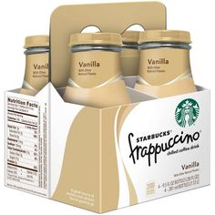 three starbucks coffee cups in a carton