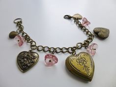 This lovely charm bracelet features vintage brass hearts and glass flowers. There are three functional lockets. Title inspired by an Aztec Camera song. Measures 7 1/4 inches. Handmade in Spokane, WA. Please see store policies and info regarding metals and bracelet sizing. Antique Metal Jewelry With Heart Charm, Antique Heart-shaped Bracelets For Gift, Vintage Pink Charm Jewelry, Antique Heart-shaped Bracelets As Gift, Antique Heart-shaped Bracelet For Gift, Vintage Pink Jewelry With Charms, Pink Vintage Jewelry With Charms, Vintage Heart Charm Bracelet For Valentine's Day, Antique Charm Bracelet With Vintage Charm As Gift