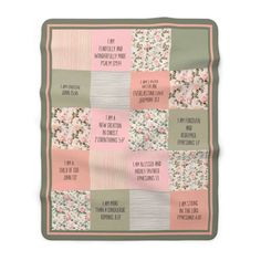 a pink and green patchwork blanket with words on it