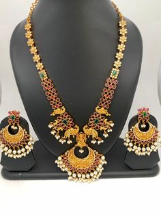 Goddess Lakshmi Peacock Red Stone Chandbali Pattern Necklace with Chandbali Very elegant and traditional necklace for this festive season. Premium quality and craftmanship Necklace Length : 18 Inches;  Earring Length : 2.5 Inches Screw Back Ready to ship from Boston, MA If you have any questions please let me know. Festive Bollywood Jewelry Sets With Peacock Design, Red Peacock Design Necklace As A Gift, Festive Chandbali Temple Necklace With Peacock Design, Red Peacock Design Necklace For Gift, Red Peacock Design Necklace As Gift, Red Temple Jewelry With Peacock Design, Festive Peacock Design Jewelry Sets, Festive Chandbali Kundan Necklace With Peacock Design, Chandbali Peacock Design Temple Necklace For Celebrations