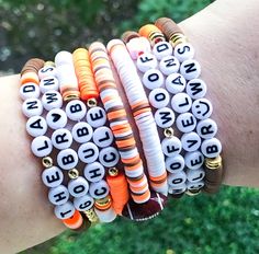 Cleveland Browns Bracelets 🧡🧡 Are you ready for some football?? 🏈 🏈 Get game day ready with this cute football stack. Sold individually or as a set.  *When purchasing multiple bracelets, please put selection in Personalization section* *If you would like something custom or different wording, please put in Personalization section* CARING TIPS FOR YOUR JEWELRY ⭐️Treat and store with care. ⭐️ For longevity, avoid exposing your jewelry to water. ⭐️ Avoid having direct contact with lotions, perfumes, sanitizers as these chemicals may cause discoloration of your jewelry. Team Bracelets, Inspired Bracelets, Football Bracelet, Go Browns, Browns Football, Clay Bead Bracelet, Multiple Bracelets, Brown Bracelet, Star Bracelet