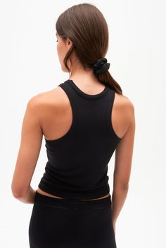 A high racer front and back neckline add a bit of sophistication to our classic tank. Super soft baby rib fabric to hug your body and layer effortlessly. BEST FOR: running, yoga, CrossFit, barre, Pilates, spin class and gym workouts. Model is 5'10" and wears a size small. NEW LONGER LENGTH Basic Stretch Racerback Tank Top, Black Tank Top For Yoga, Black Tank Top With Tank Straps For Yoga, Compressive Black Racerback Tank Top, Black Yoga Tank Top, Black High Stretch Tank Top For Yoga, Fitted Black Tank Top For Yoga, High Stretch Black Tank Top For Yoga, Black Fitted Tank Top For Yoga