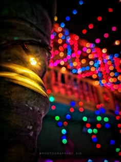 a statue with lights in the background