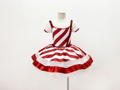 a red and white striped dress on a mannequin