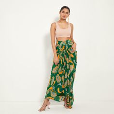 Green Paisley Draped Skirt | Style Junkiie | Wolf & Badger Fitted Green Sarong, Summer Draped Flowy Skirt, Summer Party Draped Wrap Skirt, Fitted Pre-draped Skirt For Summer, Fitted Paisley Print Skirt For Summer, Asymmetrical Green Maxi Skirt For Beach, Fitted Draped Bottoms For Summer, Fitted Green Wrap Skirt For Vacation, Summer Draped Wrap Skirt