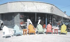 there are many chairs in front of the store