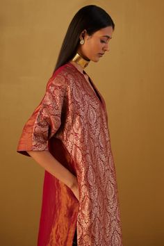 Red kaftan in Mughal brocade with floral patterns and minimal zardozi embroidery. Comes with red cotton silk pant.
Components: 2
Type Of Work: Floral
Neckline: V Neck
Sleeve Type: Three Quarter
Fabric: Kurta: Brocade and Handloom tissue, Pant: Cotton Silk, Lining: Shantoon
Color: Red
Other Details: 
Lace trims
2 pockets on kaftan and pant
Partially elasticated waistband
Length:
Kaftan: 41 inches
Pant: 36 inches
Model height: 5ft 9inches, wearing size M
Note: Dupatta worn by the model is not for Elegant V-neck Kurta For Festive Occasions, Elegant V-neck Traditional Wear With Pallu, Traditional Drape Dresses For Eid Rituals, V-neck Traditional Wear For Eid, Elegant V-neck Anarkali Set For Festive Occasions, Traditional V-neck Saree For Puja, Silk Kurta With Traditional Drape For Festive Occasions, Traditional Drape Kurta For Rituals, Festive V-neck Kurta With Zari Work