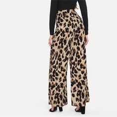 These leopard print pants bring some fabulous flare to your wardrobe. Featuring a mid-waist and fared legs with a flat front. These pants pair perfectly with a bodysuit, blouse or sweater; perfect in and out of the office. Made with a polyester blend for comfort and style. Chic Leopard Print Pants For Work, Chic Leopard Print Workwear Bottoms, Trendy Leopard Print Pants For Work, Leopard Print High Waist Bottoms For Work, High Waist Leopard Print Bottoms For Work, Trendy Non-stretch Leopard Print Pants, Chic Leopard Print Bottoms For Fall, High Waist Leopard Print Fall Pants, High Waist Leopard Print Pants For Fall