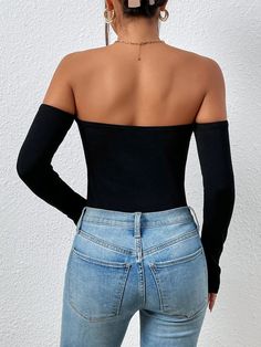 This Off-Shoulder Bodysuit is a showstopper. The long sleeves and slim fit design flatter your figure, while the medium-stretch fabric ensures comfort. The black color adds sophistication, perfect for a night out with friends or a date. The 95% Polyester and 5% Elastane composition ensures durability and easy maintenance. Whether you pair it with jeans or a skirt, you're sure to turn heads. Features: Color: Black Neckline: Off the Shoulder Sleeve Length: Long Sleeve Sleeve Type: Regular Sleeve F Chic Long Sleeve Bodycon Bodysuit, Long Sleeve Bodycon Top For Club, Bodycon Long Sleeve Top For Club, Fall Black Elastane Bodysuit, Solid Stretch Bodysuit For Date Night, Long Sleeve Elastane Bodysuit For Club, Chic High Stretch Long Sleeve Bodysuit, Trendy Long Sleeve Bodysuit For Evenings, Black Long Sleeve Bodycon Bodysuit