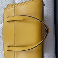 This Is A Never Used Kate Spade Small Purse. I Like The Color But Never Used It Due To The Amount Of Bags That I Have. Elegant Yellow Satchel With Top Carry Handle, Elegant Yellow Bag With Branded Hardware, Elegant Yellow Bags With Branded Hardware, Elegant Yellow Shoulder Bag With Top Carry Handle, Elegant Yellow Shoulder Bag With Top Handle, Elegant Yellow Satchel With Gold-tone Hardware, Elegant Yellow Bag For Work, Elegant Yellow Workwear Bag, Elegant Yellow Satchel For Evening