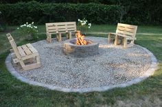 a fire pit with benches around it