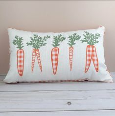 a pillow with carrots printed on it