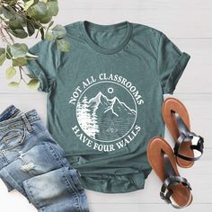 Not All Classrooms Have Four Walls Shirt, Homeschool Shirt, Gift For Teacher, Homeschool Mom, Homeschooling Tee, Gift For Student, School Tee BLACK TEXT is used for Yellow, Heather Peach, White, Light Gray Heather, Mint, Pink Shirts. Other colored shirts have white text. F I T ∙ & ∙ S I Z I N G : -->Women's sizes are narrower than the waist. -->Sleeves are rolled up in some product pictures. They do not come rolled up on delivery. T I M E ∙ T O ∙ D E L I V E R Y : -->Processing and production ti Not All Classrooms Have Four Walls, Homeschool Mom Shirts, Green School Spirit Tops For School, Green Graphic Print Tops For School, Homeschool Shirts For Kids, Green Pre-shrunk Shirt For School, Green Letter Print Top For School, Green Letter Print T-shirt For End Of School Year, Green School Tops With Text Print