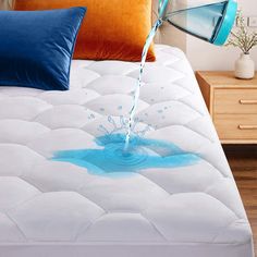 a bed with blue water coming out of it