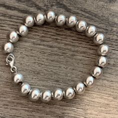 "This is a favorite style Sterling silver 6mm Bead Ball Bracelet. Has Lobster Clasp closure for added security. Please note: I can add a larger lobster clasp and jump ring to increase the length the 7.5\". Convo me if you want to upgrade to larger bracelet. Cost additional $3.00. Approx. 7\" Sterling silver bead ball bracelet Approx. 6mm Bead Ball size beads Approx. 14.3 grams REF: \"7\" Sterling Silver 6mm Bead Ball\" Bracelet" Metal Bead Bracelet, Bead Ball, Large Bracelet, Metal Bead, Mookaite Jasper, Ball Bracelet, Custom Earrings, Silver Bead, Statement Bracelet