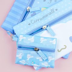 Use this set of kawaii zippered flat pouches to organize your things! The set features cute illustrations of a chubby Cinnamoroll with prints of hearts and avocados. Each pouch comes in a different size so you can use them for different purposes. Set includes 3 pouches Kawaii Bags With Pen Holders For Gifts, Kawaii Bags With Pen Slots For Everyday Use, Cute Blue Cosmetic Bag For School, Cute Rectangular Travel Stationery, Kawaii Stationery With Zipper Pouch, Kawaii Bag With Pen Holders For Daily Use, Kawaii Zipper Pouch Cosmetic Bag Gift, Kawaii Zipper Pouch Pencil Case Gift, Kawaii Cosmetic Bag With Zipper Pouch As Gift