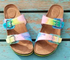 Be Soleful! Tie-Dye Birkenstock-style adjustable buckled slide sandals perfect for the hippie chick! Hand-painted with ecofriendly dye and made to order in women's sizes 6-11. Be super comfy and cute in these tie-dye slide sandals! **Half sizes not available** **Please note these are NOT the Birkenstock brand - they are made from high quality shoe that are just as cute and comfy** Adjustable Buckle Closure Sandals For Festival, Multicolor Adjustable Sandals, Multicolor Adjustable Strap Sandals, Casual Hand Painted Sandals For Summer, Casual Multicolor Hand Painted Sandals, Casual Hand Painted Sandals For Beach, Multicolor Summer Sandals With Adjustable Strap, Adjustable Slides With Buckle Closure For Spring, Casual Multicolor Adjustable Slides