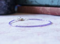 This cute dainty bracelet is handmade with violet purple Japanese seed beads and sterling silver findings (the heart charm is silver plated). The bracelet fastens with sterling silver lobster clasp. You can choose the length of your bracelet before putting it in the cart. More bracelets - https://www.etsy.com/shop/SentimentoShop?section_id=13605661&ref=shopsection_leftnav_2 Please contact me if you have any questions. Thank you for looking and have a great day! Please note: actual color shade may vary from picture due to computer settings. Purple Seed Bead Bracelet, Small Beads Bracelet, Small Bead Bracelet, Bracelet Simple, Seed Bead Bracelet, Small Beads, Bracelet Dainty, Dainty Bracelet, Violet Purple