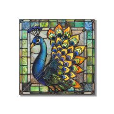 a stained glass window with a peacock on it