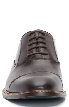 A rich leather upper and cap toe add timeless sophistication to a streamlined oxford that will complement your sleek looks. Lace-up style Leather upper/synthetic and textile lining/rubber sole Imported Brown Cap Toe Oxfords With Leather Lining, Brown Leather Oxford Shoes For Derby, Brown Leather Oxford For Derby, Fitted Brown Cap Toe Oxfords, Fitted Leather Oxford Shoes With Goodyear Welt, Classic Brown Oxford Shoes For Business, Fitted Brown Oxfords For Derby, Fitted Brown Oxfords With Leather Footbed, Classic Brown Dress Shoes With Rubber Heel Cap