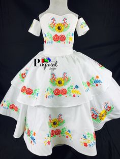 This beautiful dress resembles the escaramuza girls from Mexico. It is also calle charro dress. Is it beautiful, the detail on it is a work of art. All the embroidery is specially designed. I choose this colors because that how the customer wanted, but keep in mind it is made by order. That meant I can customize it however you want. Any color you choose I'll be happy to make it perfect for you. The dress is one piece but I also include a tulle underskirt to make it full but confortable I case th Traditional Fitted Dress With Attached Cancan, Traditional White Costume Dress, White Dresses For Cinco De Mayo Fiesta, Traditional Ruffle Dress For Fiesta, Traditional Wedding Dress For Fiesta, Red Charro Dress, Escaramuza Dress, Escaramuza Dresses, Charro Dress