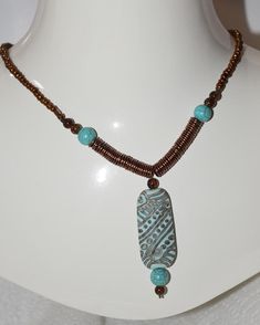 Turquois clay bead accented by copper and howlite beads Brown Beaded Turquoise Necklace With Round Beads, Artisan Brown Turquoise Necklace For Jewelry Making, Artisan Beaded Brown Turquoise Necklace, Artisan Brown Beaded Turquoise Necklace, Artisan Brown Turquoise Necklace With Gemstone Beads, Blue Beaded Copper Necklace, Copper Jewelry With Colorful Beads, Earthy Turquoise Jewelry With Wooden Beads, Brown Copper Jewelry With Spacer Beads