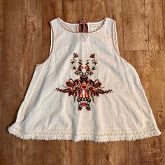 Nwot Max Studio Boho Embroidered Gauze Blouse Size Xs White W/ Coral & Olive Floral Embroidery! Frayed Hem, Tassel Style Tie In Back! 100% Cotton; Lightweight & Breathable- Perfect For Summer! Ships Fast From Clean Smoke Free Home! Red Sleeveless Top With Floral Embroidery, Red Sleeveless Tops With Floral Embroidery, Sleeveless Red Tops With Floral Embroidery, White Cotton Top With Embroidered Hem, Casual Sleeveless Top With Embroidered Hem, Casual Red Cotton Embroidered Top, White Cotton Embroidered Top With Embroidered Hem, White Cotton Blouse With Embroidered Hem, White Cotton Embroidered Top With Hem Detail